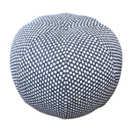 Seabrook Outdoor Ottoman in Wicker Outwick Royal Blue, featuring a round shape and a navy blue and white geometric pattern, shown against a white background.