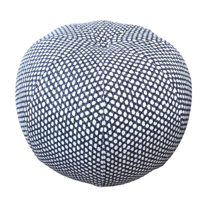 Seabrook Outdoor Ottoman in Wicker Outwick Royal Blue, featuring a round shape and a navy blue and white geometric pattern, shown against a white background.
