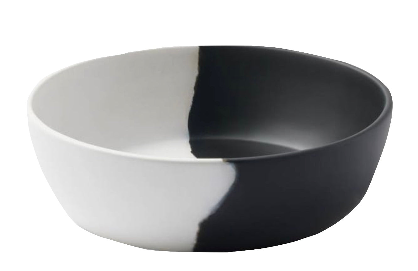 Two-toned Blue Pheasant Maxton White & Black resin serving bowl with a split design of black and white, perfect for any dinner party.