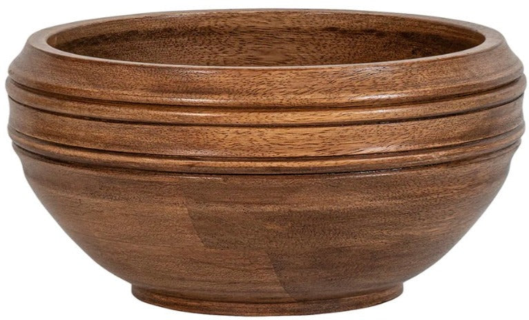 A brown wooden bowl from the Juliska Bilbao Wood Serving Collection, crafted from rich Mango wood, features a slightly tapered base and an elegant ringed design around the upper portion. This artisanal piece adds a touch of timeless beauty to any setting.