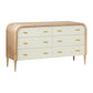 The Pierre Dresser in Pristine Shagreen and Washed Oak features six drawers with light beige fronts, a rounded frame, tapered legs, and gold-toned vintage-style handles.