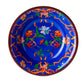 Blue bowl featuring a vibrant floral pattern in orange, red, and white from the Mario Luca Giusti Pancale Blue Collection. Labeled "Soup Bowl" at the bottom.