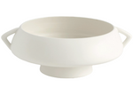 The Crete Bowl is a white, round ceramic bowl with two handles and a small pedestal base, featuring a matte white glaze from the Crete Collection. Handmade in Portugal.