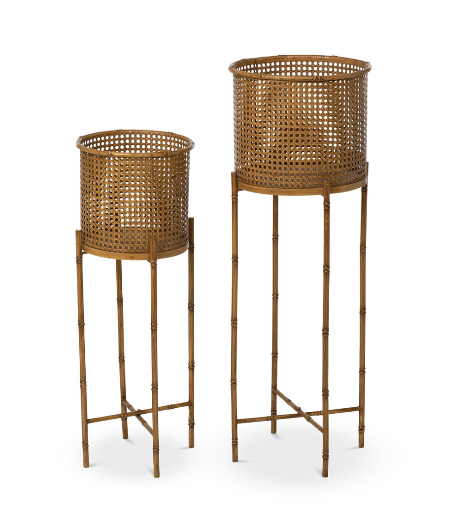 Two gold-colored Roanoke Metal Planter on Stand pieces feature perforated cylindrical baskets and tall, slender legs in varying heights, adding modern elegance and durable metal construction to your space.