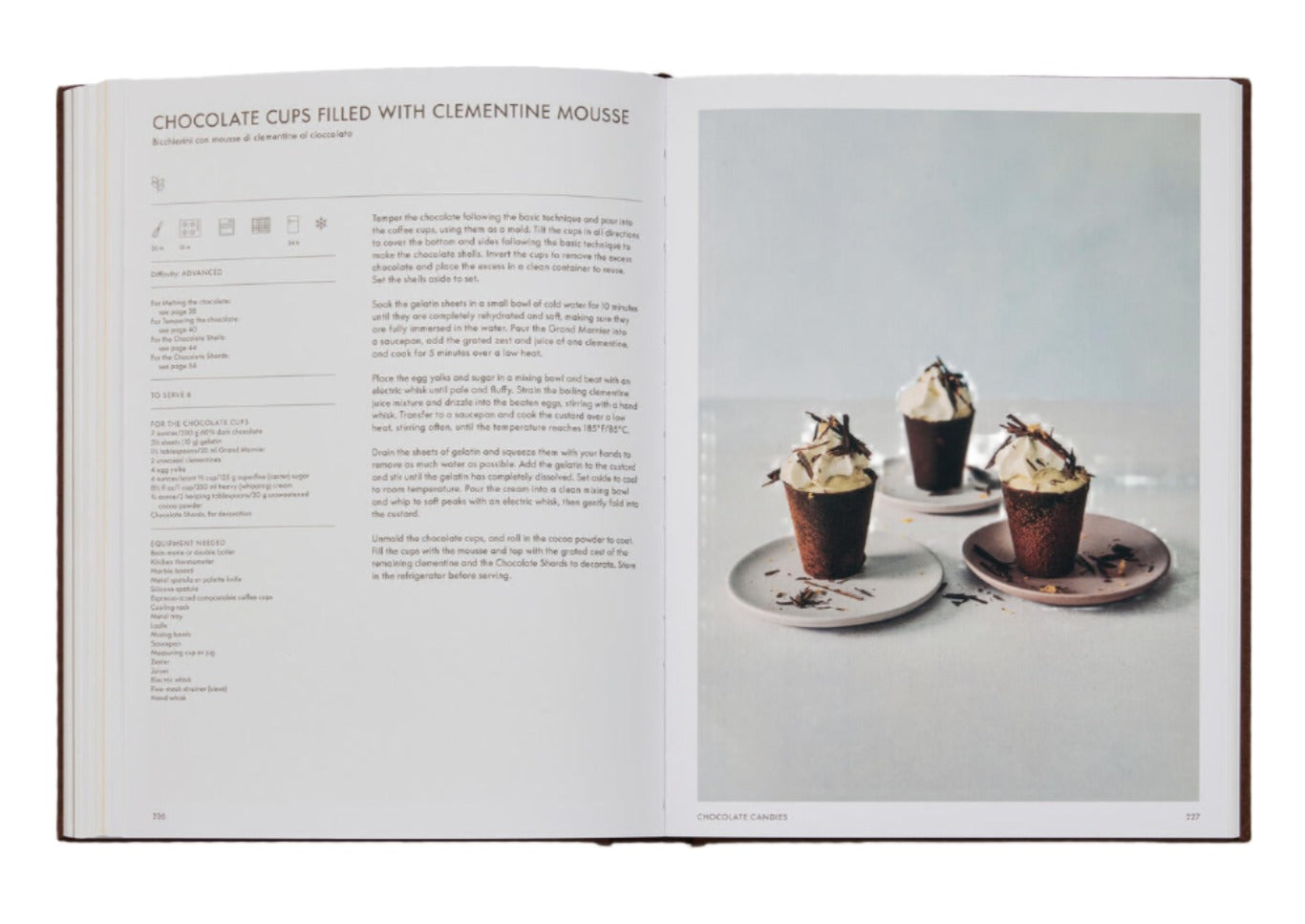 Open cookbook showcasing a recipe for Chocolate Cups Filled with Clementine Mousse on the left page and a photo of three dessert cups on the right, perfect for enthusiasts of The Chocolate Spoon: Italian Sweets From The Silver Spoon.