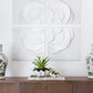 A wooden console table with gold handles displays ceramic vases and succulents, with the White Flower Quadrant four-piece wall art set arranged in a 48" x 48" display above.