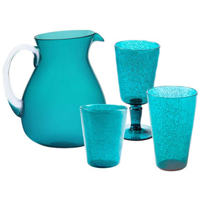 The Memento Acrylic Turquoise Collection brings an elegant flair to outdoor dining, featuring a turquoise pitcher with a handle and three coordinating acrylic pieces: a goblet, a tall glass, and a short glass.