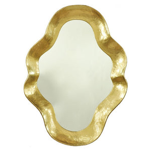 The Venus Mirror in Gold Lacquer features an irregular, wavy frame with a textured gold finish, creating sophisticated elegance against a plain background.
