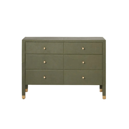 The Conner Dresser features six drawers, an olive green finish, classic silhouette, gold knobs, and gold-capped legs, displayed against a white background.