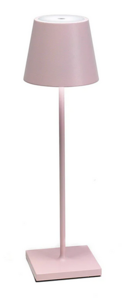 A tall, pink Zafferano Poldina Pro Cordless Lamp with a cylindrical base, a slender rod, and a conical lampshade, providing cordless illumination thanks to its rechargeable battery.