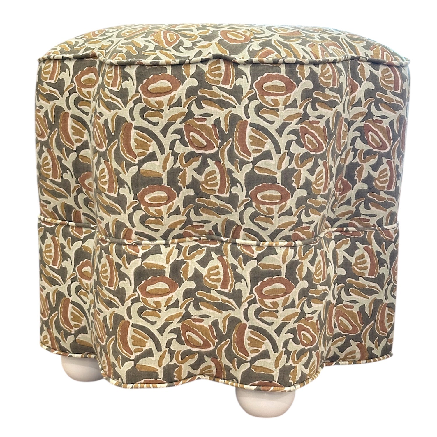 The Stella Stool in Marbella Linen Eucalypt on White is a square, upholstered ottoman with floral-patterned fabric and white bun-shaped legs, perfect for compact seating or use as a stylish accent stool.
