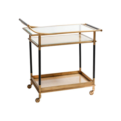 The Mayfair 59 Bar Cart features a vintage brass and black finish, two glass shelves, four wheels, and handles—ideal for entertaining. Shown on a white background.