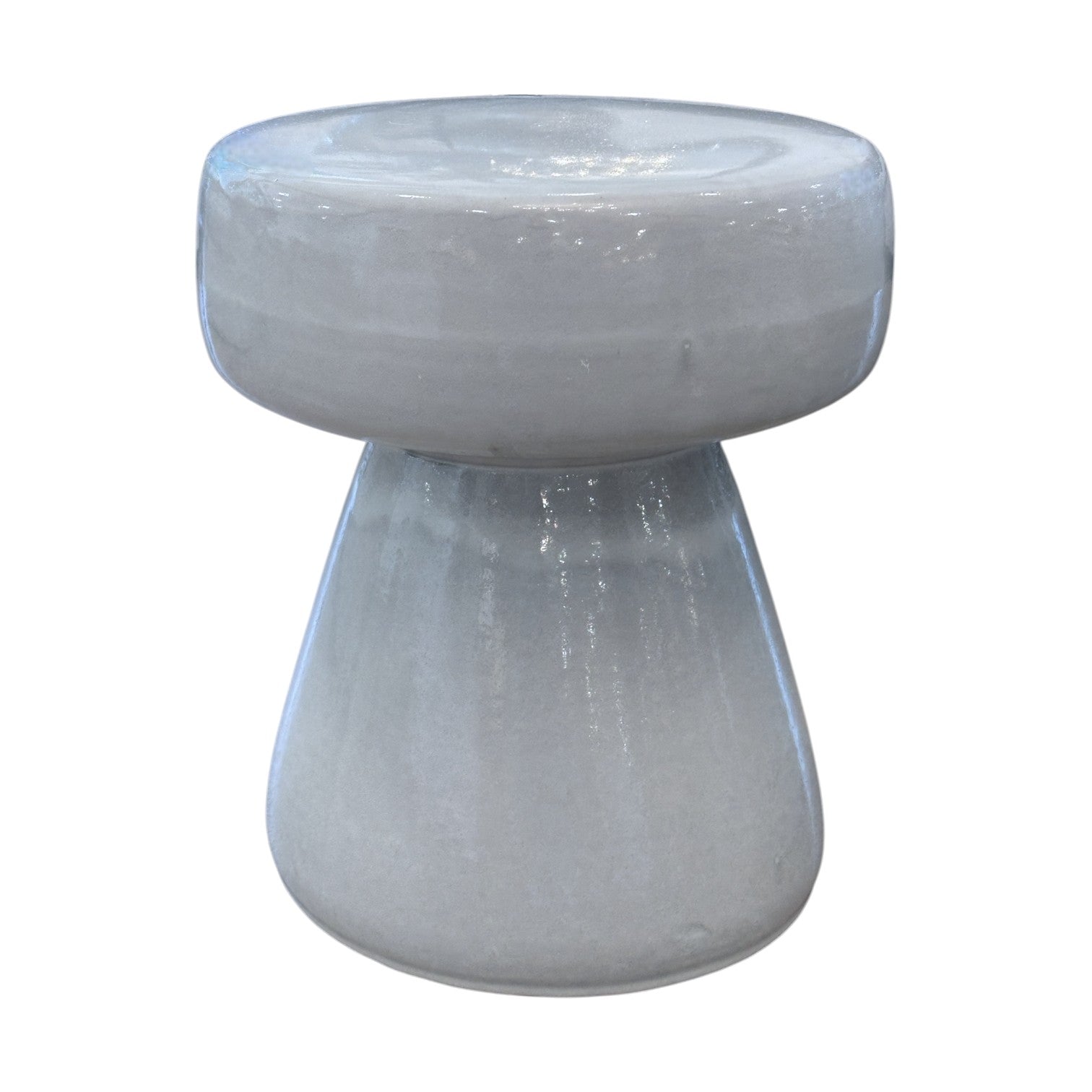 The Mushroom Stool features a glossy, light gray porcelain finish, a round flat top, and a wide conical base in a unique mushroom shape. It's shown against a white background.