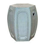 The Natural Mineral Glazed Solid Hexagonal Stool features a light gray finish, paneled sides, and a small circular cutout, offering an antique look inspired by traditional dragon kiln craftsmanship.