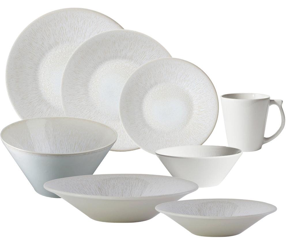 The Jars Vuelta White Pearl Collection is a set of white ceramic dinnerware that includes plates, bowls, and a mug, all featuring a subtle textured design with classic elegance.