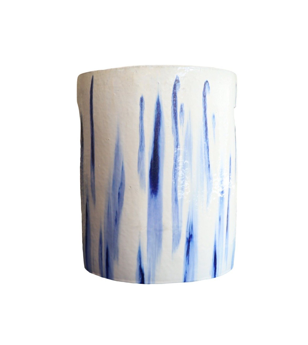 The Cylinder Stool in White and Blue Glaze features a cylindrical form with vertical blue brushstroke patterns on white, giving it an antique look reminiscent of traditional dragon kiln ceramics.