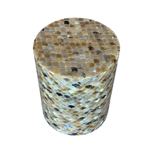 The Horn Scallop Stool features a cylindrical design with a mosaic of small, rounded tiles in brown, beige, and black—offering sculptural style and contemporary flair to any space.