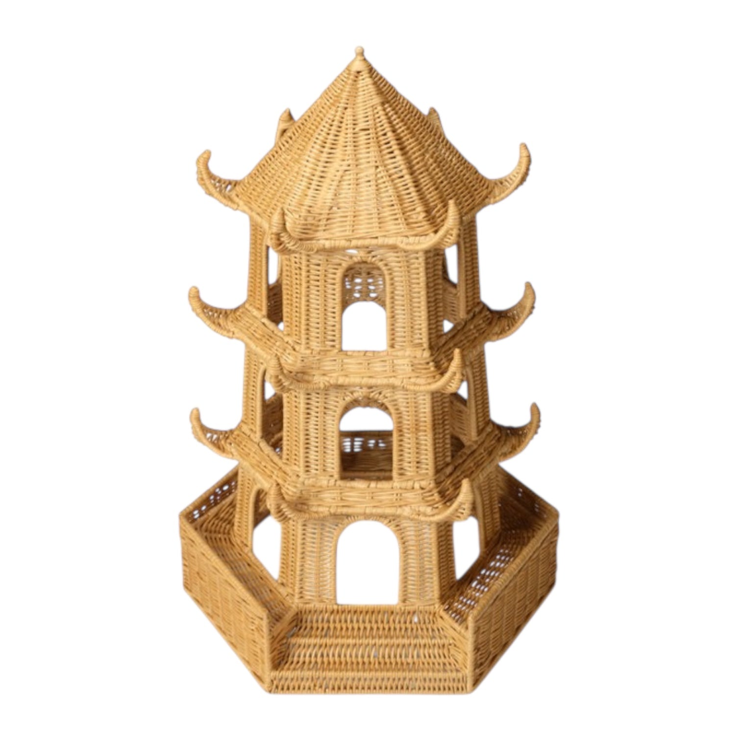 The Bardot Pagoda in Light Honey Rattan is a three-tiered piece with a hexagonal base, arched openings, and curved upturned roof edges inspired by traditional Thai architecture.