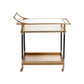 The Mayfair 59 Bar Cart, featuring a gold and black vintage brass frame, two glass shelves, and four caster wheels, is perfect for entertaining. Displayed against a white background.