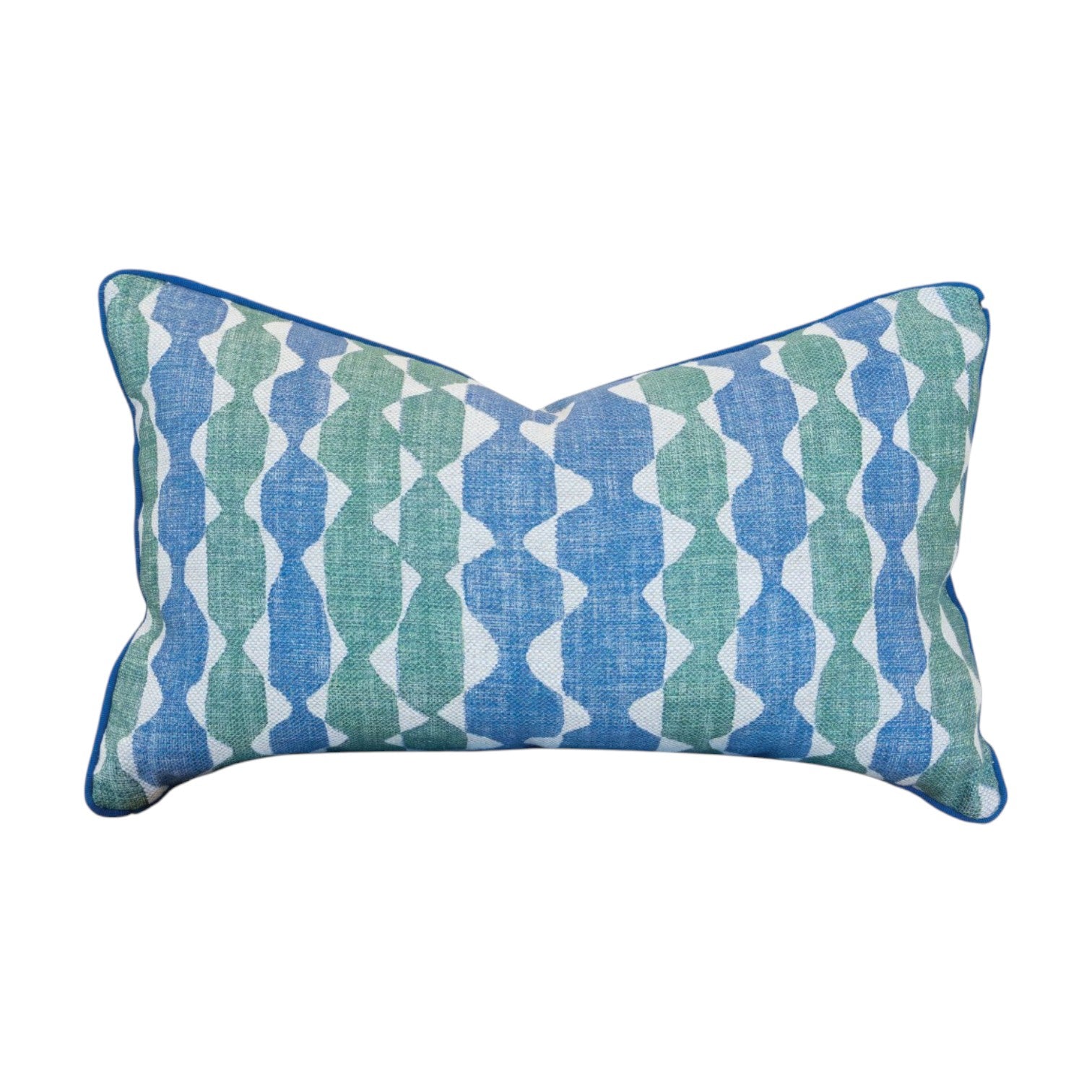 The Whittle Blue Green Lumbar Pillow features a blue and green geometric pattern on a white background, complemented by blue piping along the edges and a hidden zipper closure for a seamless finish.