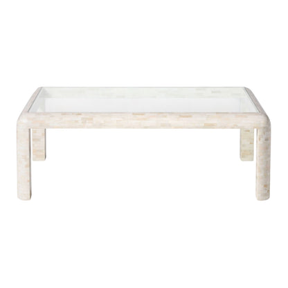 The Harley Natural Bone Coffee Table features a rectangular design with rounded legs, a glass top, and a light-colored tiled base.