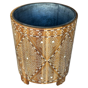 The Large Wood and Bone Planter features elegant bone inlay with geometric and floral patterns, a metal-lined interior, and stands on three short legs.