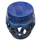 The Dark Blue Circle Garden Stool features a glossy blue ceramic finish, solid top, and decorative openwork sides, presenting an antique look inspired by traditional rustic stools.