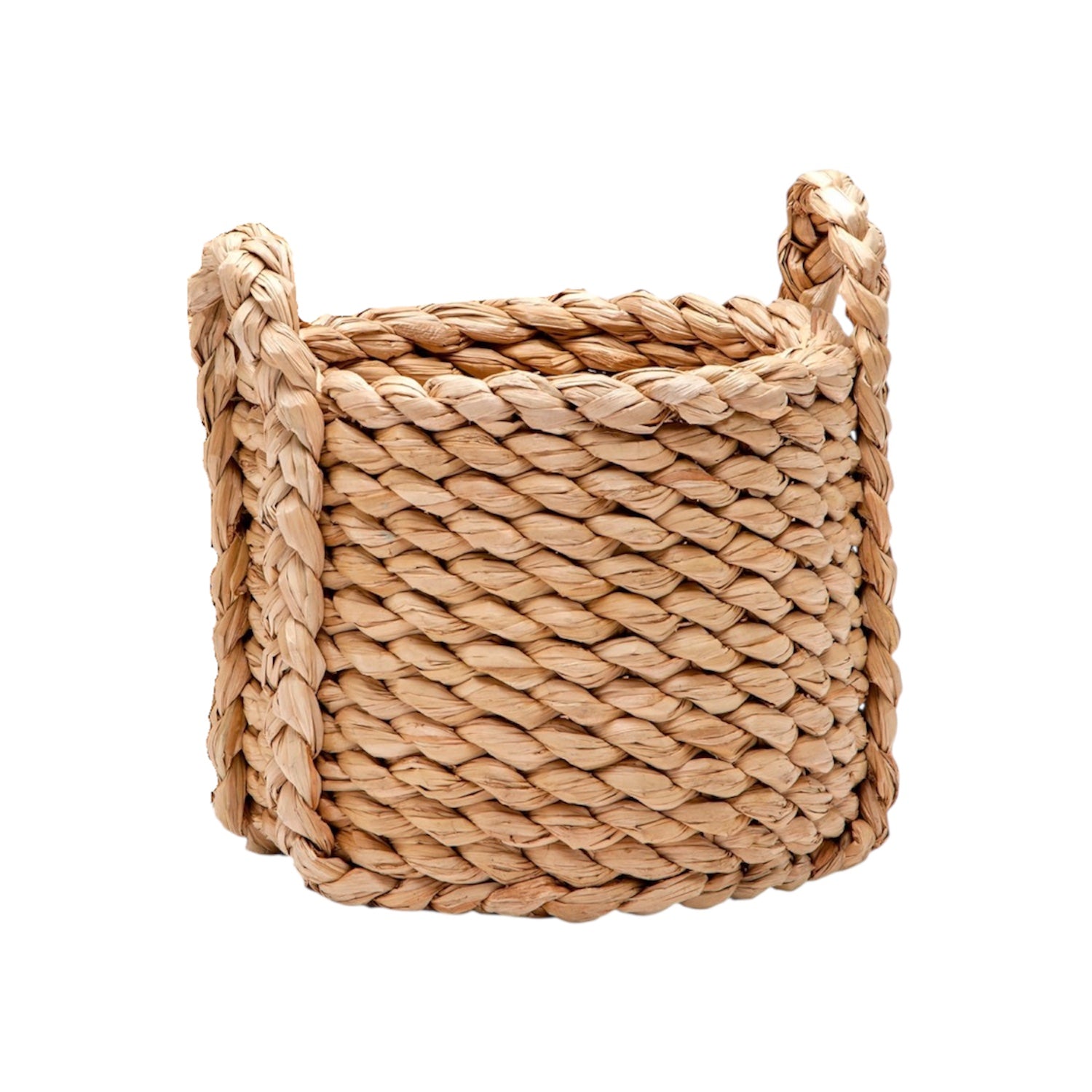 The Raquel Woven Seagrass Round Basket, Small, features braided handles and natural straw construction, making it perfect for casual storage. Its round design is crafted from seagrass and looks great isolated on a white background.