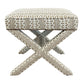 The X Bench is a square upholstered ottoman with custom geometric brown and white fabric and striking X-shaped legs, making it an elegant addition to any space.