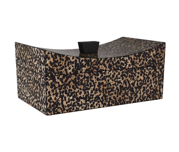 The Yarin Box is an elegant black and ivory eggshell lacquer storage box with a leopard-print design, featuring a curved lid and a black handle.