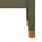 Close-up of the Conner Dresser’s corner, showing green textured finish, gold metal caps on wooden legs, and contrast stitching, set against a white background.