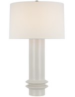 Introducing the Montaigne Medium Table Lamp, New White, featuring an artisanal pottery base paired with an elegant linen shade. This sophisticated piece combines timeless design with a classic white lampshade, perfect for any stylish interior.