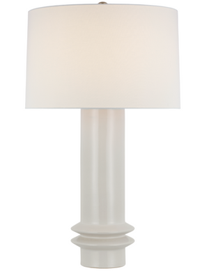 Introducing the Montaigne Medium Table Lamp, New White, featuring an artisanal pottery base paired with an elegant linen shade. This sophisticated piece combines timeless design with a classic white lampshade, perfect for any stylish interior.