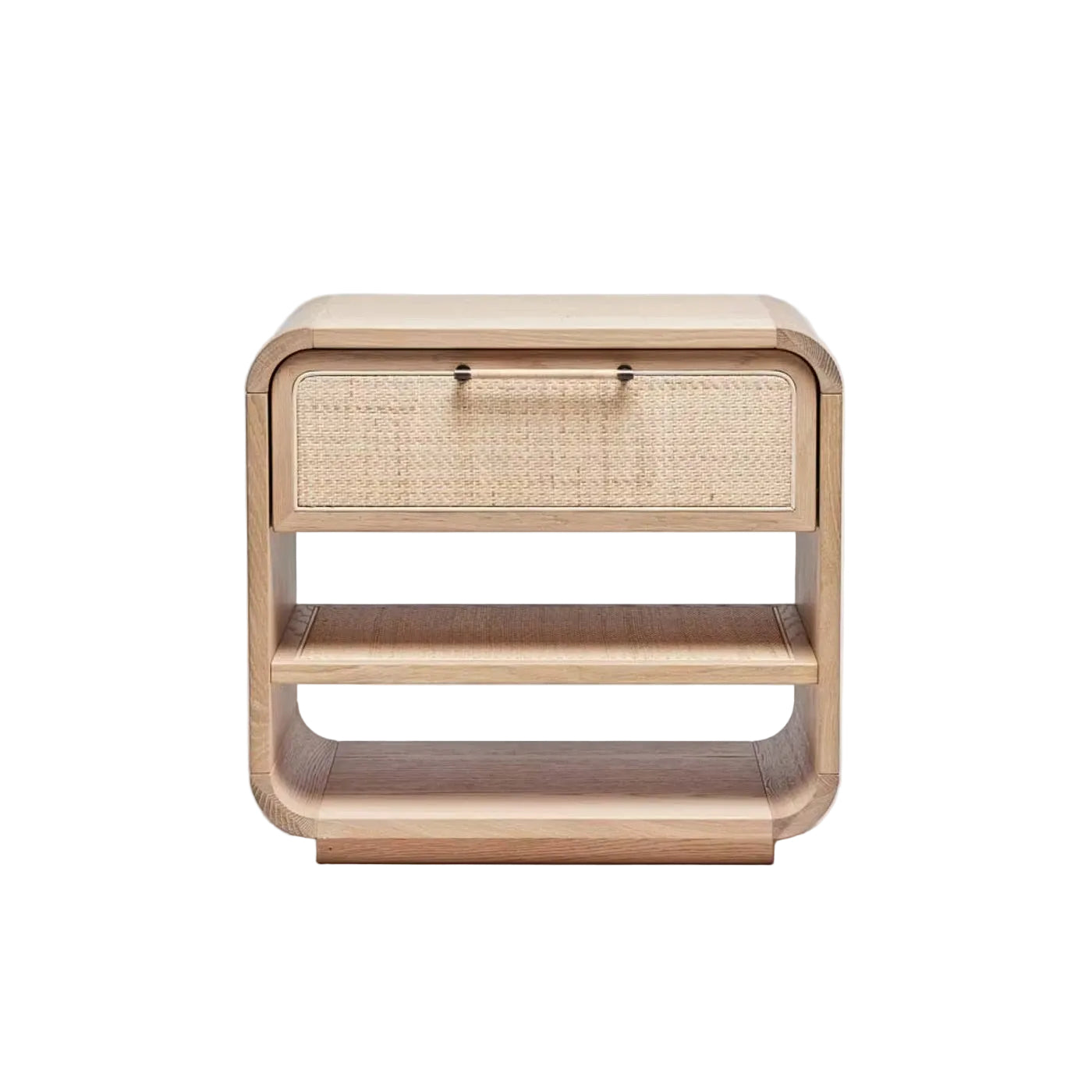 The Marsh Bedside Chest features a wooden build with rounded edges, a single drawer with a blonde rattan front, and two open shelves underneath.