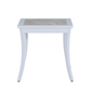 The Bermuda Aluminum End Table is a small white outdoor table with curved legs and a rectangular porcelain top inset, shown against a plain white background.