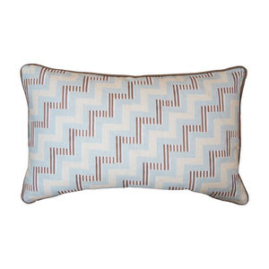 The Ziggy Sky Lumbar Pillow features a light blue and brown geometric zigzag pattern with dark piping, crafted from premium materials for an elegant touch.