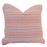 The Avia Terracotta Pillow is a 22x22 square throw pillow featuring a textured pattern of horizontal orange and white stripes on a crisp white background, adding a vibrant accent to any space.