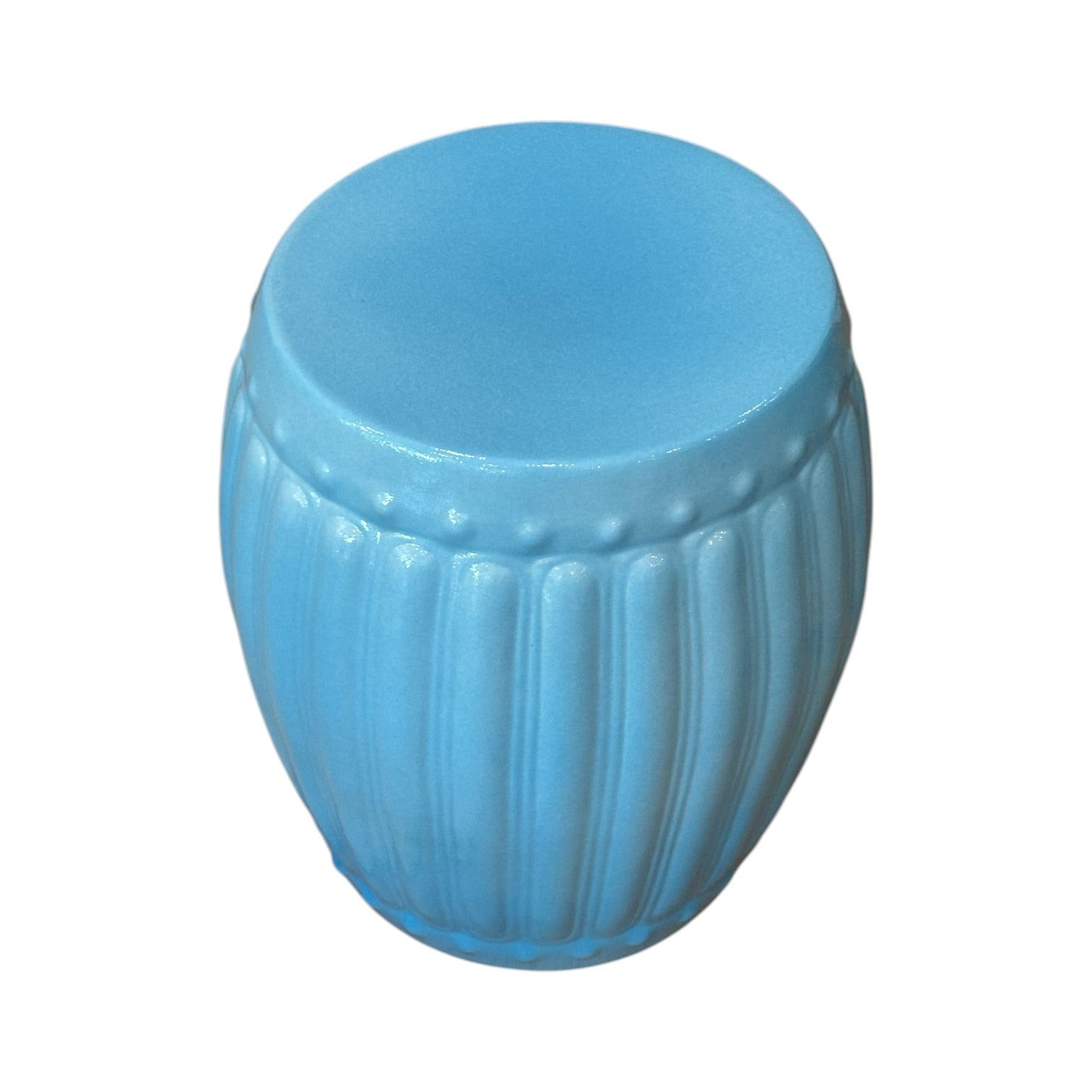 The Porcelain Ribbed Garden Stool in Lagoon Blue features a vertical ribbed design and elegant glaze, highlighting the craftsmanship of quality porcelain.