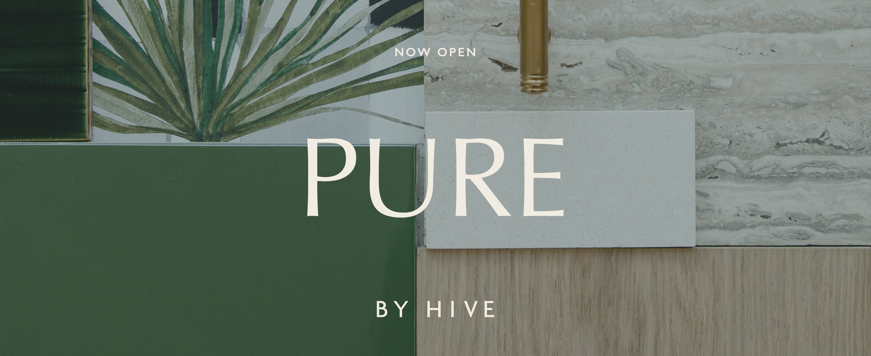 A desktop orientated image of Pure by Hive design scheme utilizing natural, tropical hues with a palm leave wallpaper, rich green tile and modern brass hardware.